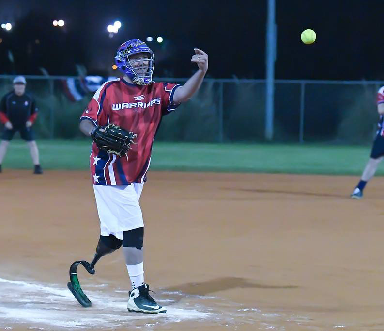 Prosthetic Athlete playing softball
